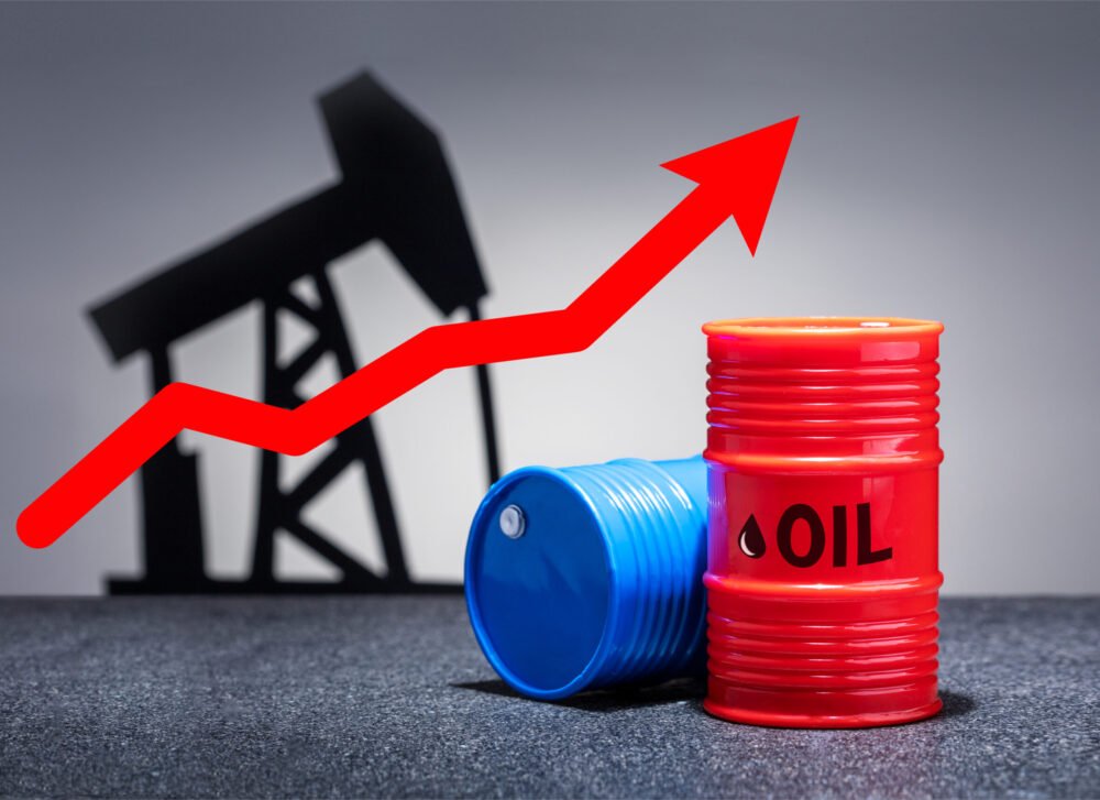 Oil barrels with a red up arrow on grey background. Oil chart.