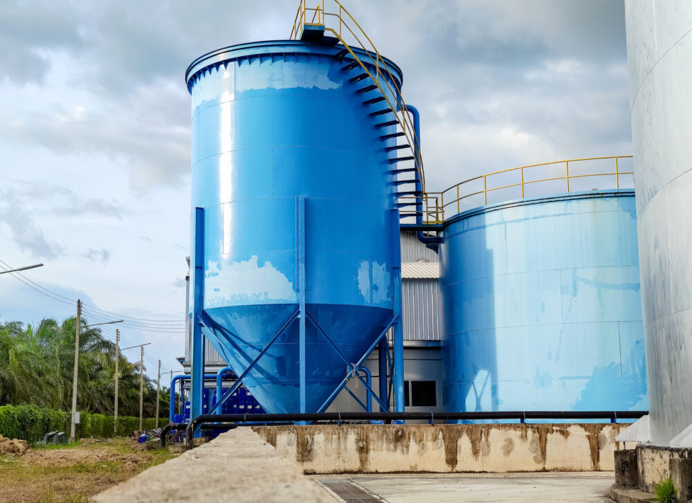 water-system-tank-structure-factory-against-sky water-system-tank-structure-factory-against-sky